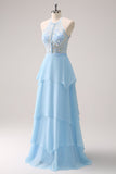 Scintillante blu Halter floreale lungo abito da damigella d'onore con lacci sul retro