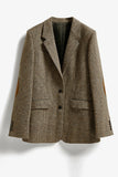 Blazer da donna sciolto con risvolto a scorciato.