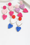 Orecchini intrecciati a forma di cuore fucsia alla moda