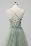 Abito da ballo lungo in tulle con lacci sul retro con paillettes verdi