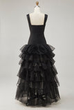 Abito formale high-low high-low in organza nera con fessura a volant