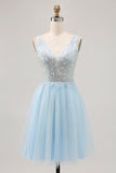Abito corto da cerimonia in tulle blu scintillante con paillettes