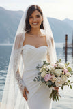 Abito lungo da sposa in merletto sirena applicato in chiffon avorio