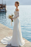 Abito da sposa lungo con fiocco sirena applicato in pizzo d'avorio
