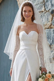 Abito da sposa lungo senza spalline in avorio con fessura