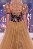 Abito lungo da gara con paillettes nere dorate