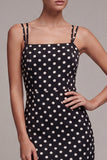Abito a spalline midi a pois con spalline sirena in bianco e nero