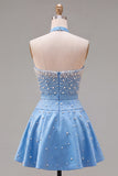 Abito corto di cocktail decorato con perle blu con collar e fiocco