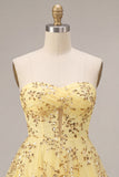 Abito giallo di Homecoming con paillettes senza spalline tagliato a linea a A