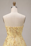Abito giallo di Homecoming con paillettes senza spalline tagliato a linea a A