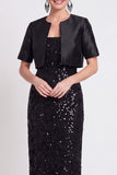 Abito lungo con paillettes nere scintillanti con fessura