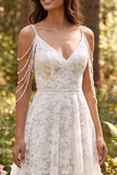 Abito da sposa lungo a spalle fredde in fiori fioreli avorio