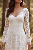 Abito da sposa a maniche lunghe in pizzo avorio con fessura