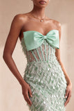 Corsetto, sirena senza spalline piumate con paillettes, vestito lungo elegante con fiocco