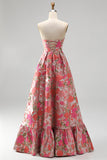 Abito lungo da cerimonia rosso a trapezio in jacquard floreale con orlo a balze e spacco senza spalline