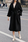 Cappotto in lana con cintura con collo con revers nero e tasche