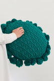 Cuscino verde lavorato a maglia