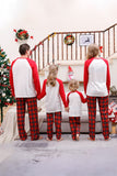 Set di pigiami di buon Natale a quadri rossi per famiglie